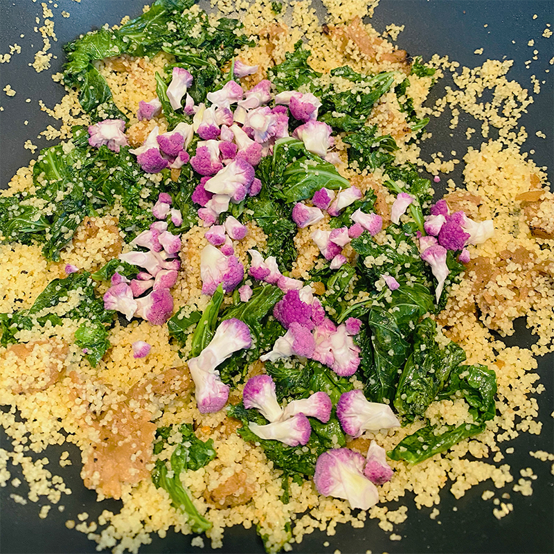 Add cauliflower florets to kale with couscous and mix on a small gas.