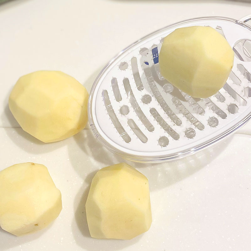 Peel and finely grate the potatoes into a large bowl.