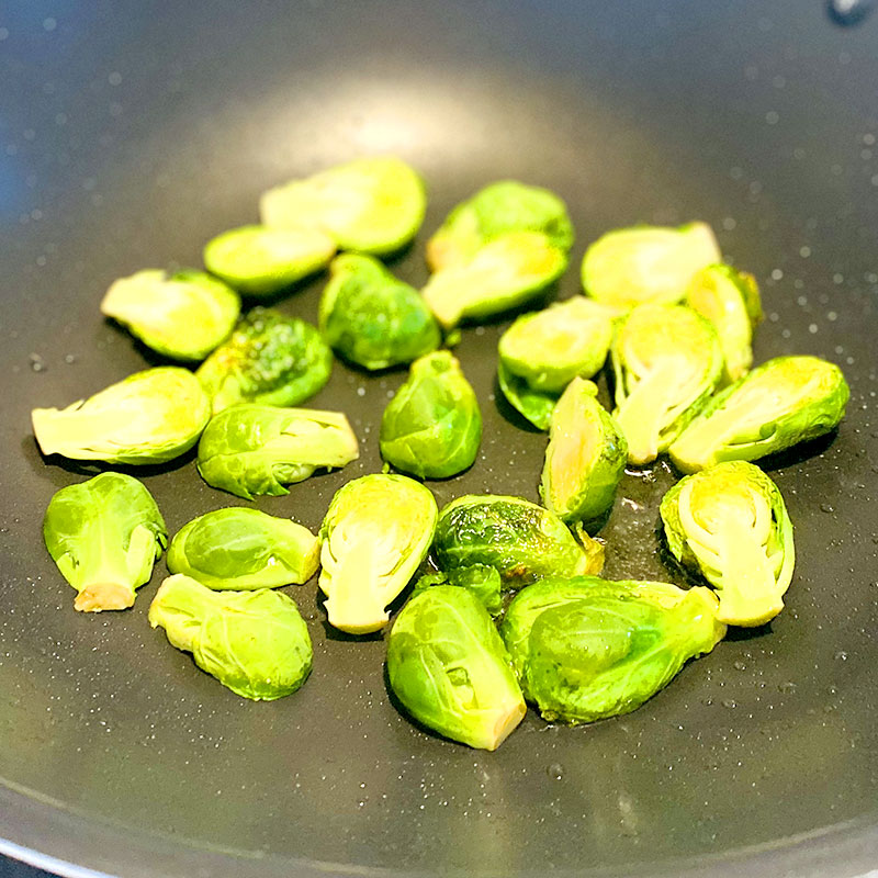 Sauté halved Brussels sprouts until they get a nice brown color. (about 3 min)