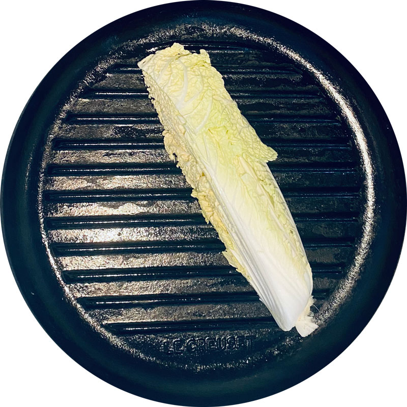 Grill the fourths of Romaine lettuce on each side.